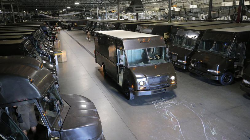 UPS drivers head en masse to their routes. BOB ANDRES /BANDRES@AJC.COM