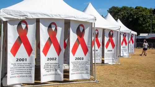 People look over the historical banners during the annual AIDS Walk Atlanta in Piedmont Park on Saturday, September 25, 2021. (Photo: Steve Schaefer for The Atlanta Journal-Constitution)