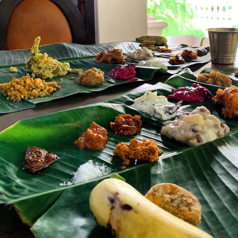 During her recent trip to India, Atlanta chef Asha Gomez reconnected with family and friends. Pictured is a lunch of various dishes on a banana leaf that a longtime friend prepared for her. CONTRIBUTED BY ASHA GOMEZ