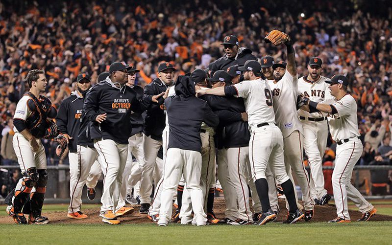 San Francisco Giants celebrate after they beat the Washington Nationals 3-2 to win Game 4 of baseball's NL Division Series in San Francisco, Tuesday, Oct. 7, 2014. (AP Photo/Marcio Jose Sanchez) These guys do this all the time, don't they? (Marcio Jose Sanchez/AP photo)