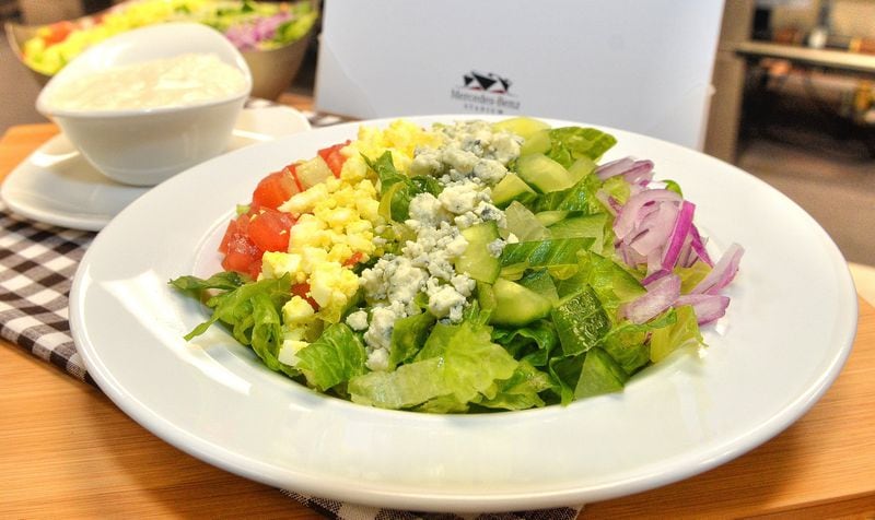 Sports fans can find healthy options at the new Mercedes-Benz Stadium, such as the vegetarian Cobb salad, with romaine lettuce, tomato, cucumbers, red onions, Gorgonzola cheese, chopped eggs and blue cheese dressing. It will be served at ATL Fan Fare in sections 105, 113, 205, 308, 322 and 329. CHRIS HUNT / SPECIAL