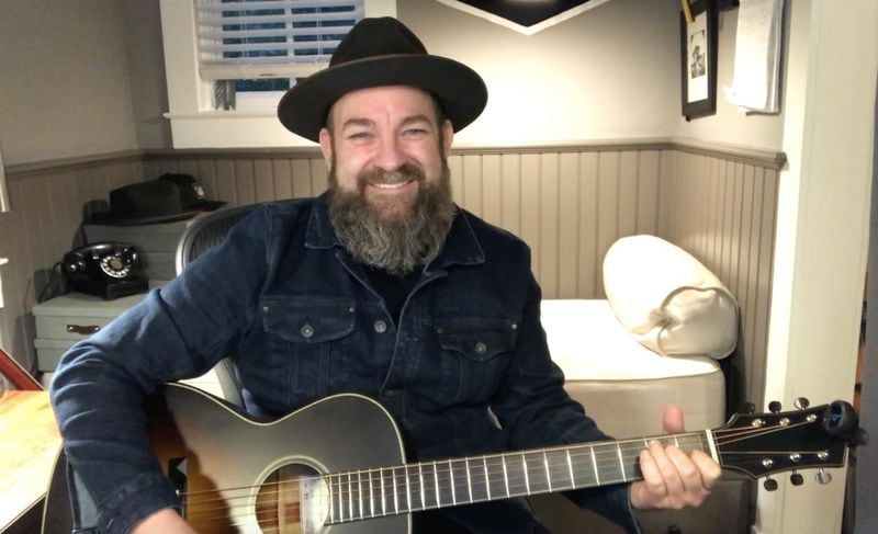 Sugarland's Kristian Bush penned an original song for President Carter's 96th birthday, using a guitar made from wood from trees on Carter's land. Courtesy World Tree