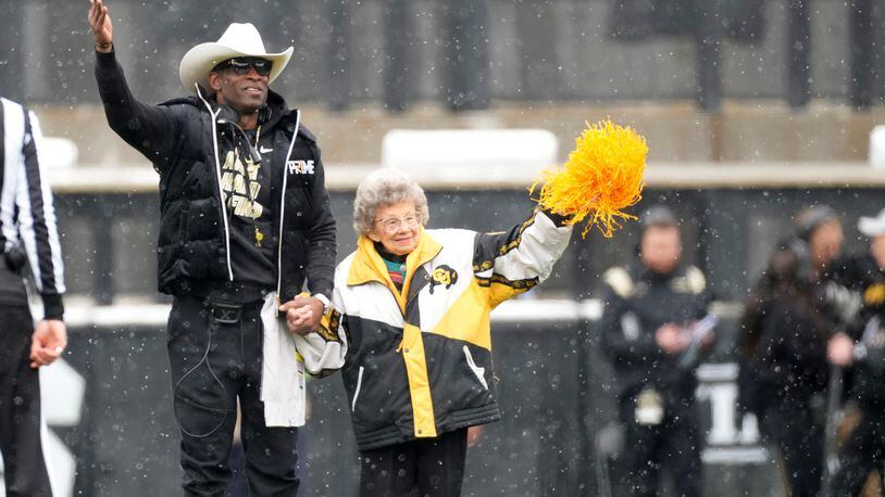 Colorado coach Deion Sanders with longtime supporter Peggy Coppom prior to the spring game in April. Coppom, 98, said she's excited about Colorado's return to the Big 12 in 2024. She has attended Colorado football games since 1940.