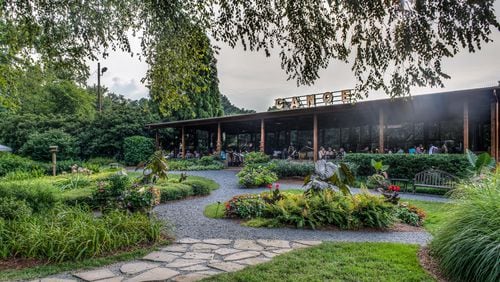 Diners relax on the lush grounds of acclaimed restaurant Canoe. Courtesy of Canoe.