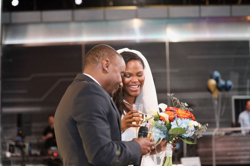 Hurricane Dorian forced Destinee Clavon and Anthony Baker to cancel their wedding plans in Charleston. They got married at work, Turner Studios in Atlanta, instead on Friday, September 6, 2019. (D'Marcus Pulse/Turner Studios/contributed photo to AJC)