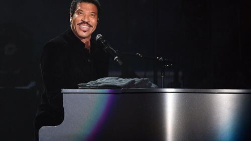 Lionel Richie, shown at the tour opener in July, said he wanted to tour with Mariah Carey because he enjoys the "odd couple" aspect of it. Photo: Getty Images