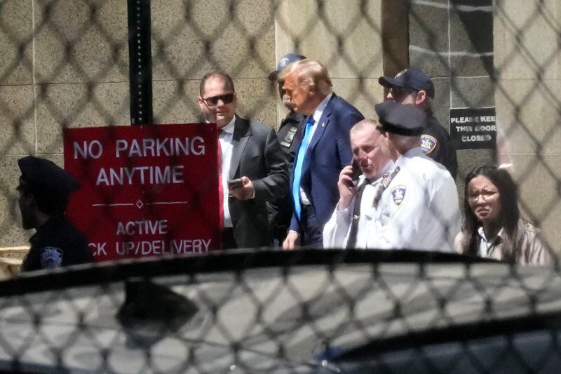 Former President Donald Trump, center, leaves Manhattan criminal court, Monday, April 22, 2024, in New York. Trump is accused of falsifying internal business records as part of an alleged scheme to bury stories he thought might hurt his presidential campaign in 2016. (AP Photo/Mary Altaffer)