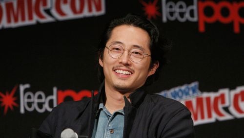 NEW YORK, NY - OCTOBER 08: Actor Steven Yeun speaks onstage as Netflix presents Dreamworks Trollhunters during New York Comic Con at Madison Square Garden on October 8, 2016 in New York City. (Photo by Lars Niki/Getty Images for Netflix)