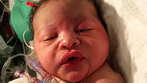 This newborn baby girl was found abandoned Monday night outside a home on Harlan Road in southwest Atlanta. WSB-TV photo.