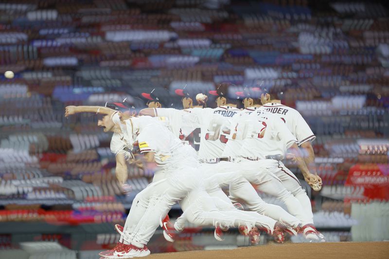 In this multi-exposure photo, Braves starting pitcher Spencer Strider (99)) throws a pitch to a Phillies batter during the fifth inning at Truist Park on Sunday, May 28, 2023, in Atlanta.
Miguel Martinez / miguel.martinezjimenez@ajc.com 