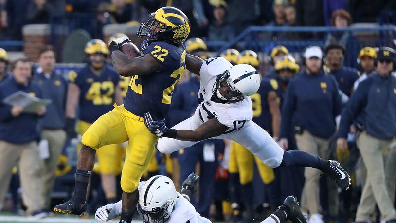 Here running against Penn State, Karan Higdon is among the Michigan stars not playing in Saturday's Peach Bowl.