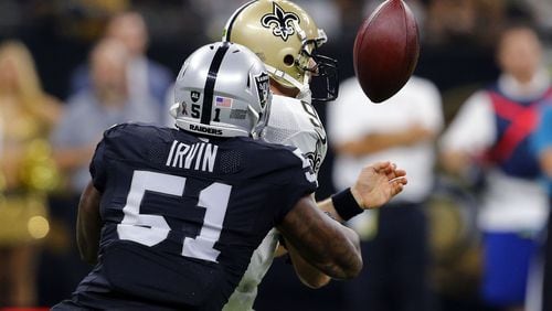 New Orleans Saints quarterback Drew Brees (9) fumbles as he is hit by Oakland Raiders linebacker Bruce Irvin (51) in the first half of an NFL football game in New Orleans, Sunday, Sept. 11, 2016. (AP Photo/Butch Dill)