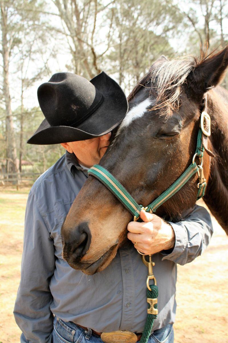 Walt Knapp, head horse trainer at High Meadows School, shares a tender moment with Bella Luna. The thoroughbred recently got a clean bill of health to participate in the school’s riding program. CONTRIBUTED BY PEGGY VOLRATH