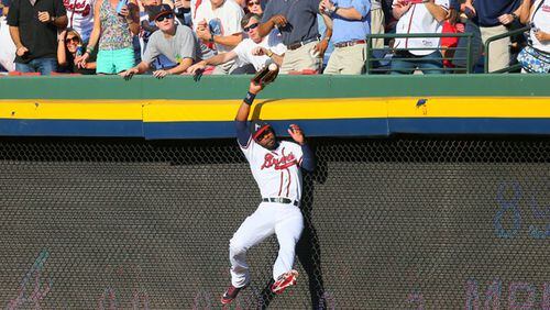 100512 ATLANTA: Atlanta Braves right fielder Jason Heyward (22) makes a leaping catch of St. Louis batter Yadier Molina's pop fly in the second inning of the National League wild card game at Turner Field in Atlanta on Friday, Oct. 5, 2012. CURTIS COMPTON / CCOMPTON@AJC.COM The man has a glove. And an arm. (Curtis Compton/AJC photo)