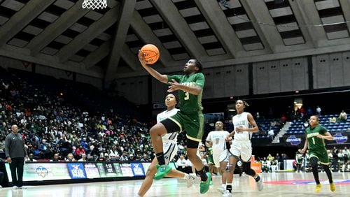 Grayson's Danielle Carnegie (3) goes to the basket for a shot during the first half of GHSA Basketball Class 7A Girl’s State Championship game at the Macon Centreplex, Saturday, Mar. 9, 2024, in Macon. (Hyosub Shin / Hyosub.Shin@ajc.com)