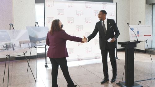 At a press conference last week, Atlanta Mayor-elect Andre Dickens greets Maria Thacker Goethe, CEO of Center for Global Health Innovation, which is opening a new hub in Atlanta. (Miguel Martinez for The Atlanta Journal-Constitution)