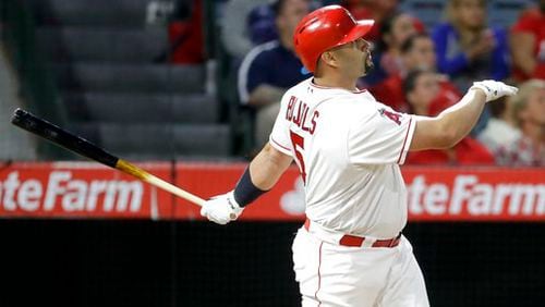 Albert Pujols watches his three-run homer off Braves pitcher Bartolo Colon in a nine-run third inning late Tuesday. It was the 599th home run of Pujols’ career. (AP Photo/Chris Carlson)