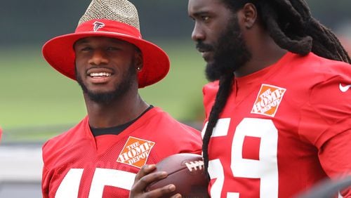 Deion Jones (left) and De'Vondre Campbell arrive for the first day of mandatory minicamp Tuesday in Flowery Branch.  Curtis Compton/ccompton@ajc.com