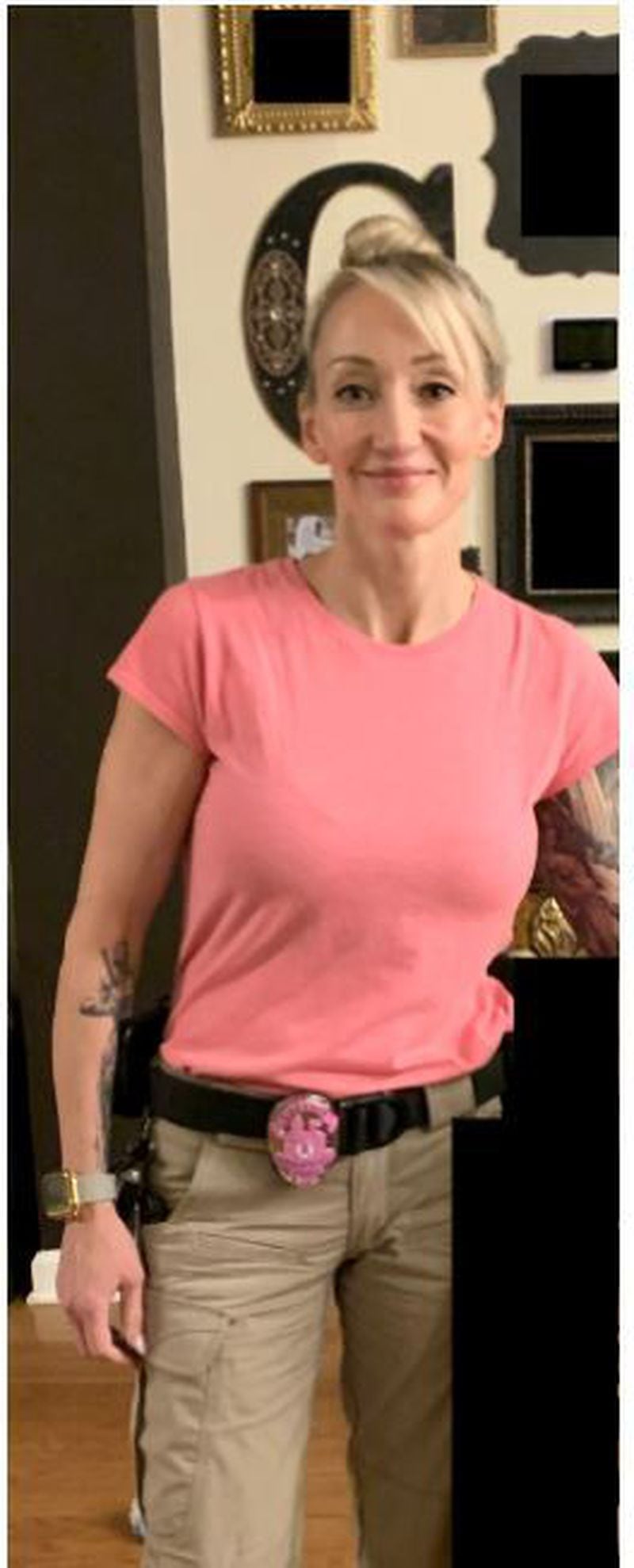 Former Lawrenceville Police Chief Tim Wallis told the Gilovanni she looked like she worked at Hooters when she wore a pink t-shirt on a day the air conditioning went out at headquarters.