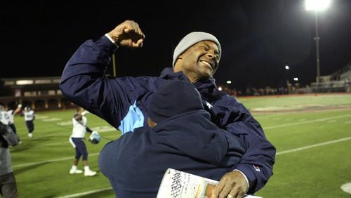 INTO THE FINALS--December 4, 2015 - Norcross, Ga: Pace Academy head coach Chris Slade, facing, celebrates with offensive coordinator Kevin Johnson after their win over GAC in the Class AA semi-final at Greater Atlanta Christian, Friday, December 4, 2015, in Norcross, Ga. Pace Academy defeated GAC 45-20. PHOTO / JASON GETZ
