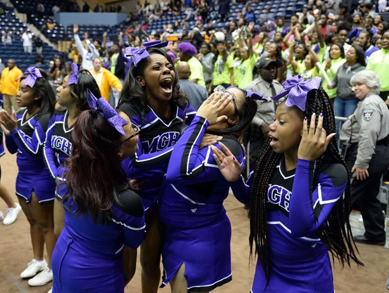 Miller Grove Wolverines cheerleaders react to a lead late in the game as they play the Allatoona Buccaneers in the Class AAAAA boys championship at the Macon Coliseum Friday, March 4, 2016. The Wolverines beat the Buccaneers 50-48, for their 7th title in 8 years. KENT D. JOHNSON/ kdjohnson@ajc.com