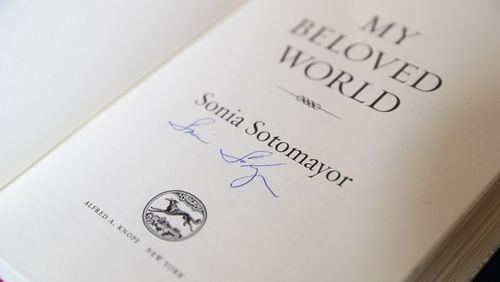 A signed copy of “My Beloved World,” by United States Supreme Court Justice Sonia Sotomayor, is purchased before she speaks with Emory University law professor Fred Smith Jr. at Emory University’s Glenn Memorial Auditorium, Tuesday, Feb. 6, 2018. ALYSSA POINTER/ALYSSA.POINTER@AJC.COM