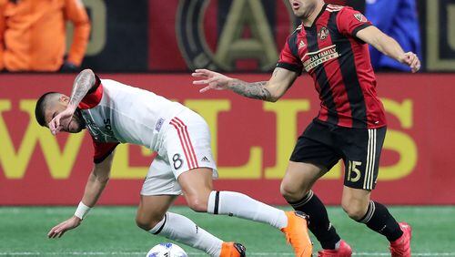March 11, 2018 Atlanta: Atlanta United forward Hector Villalba wins the battle for the ball with D.C. United player Ulises Segura during the second half in a MLS soccer match on Sunday, March 11, 2018, in Atlanta.    Curtis Compton/ccompton@ajc.com