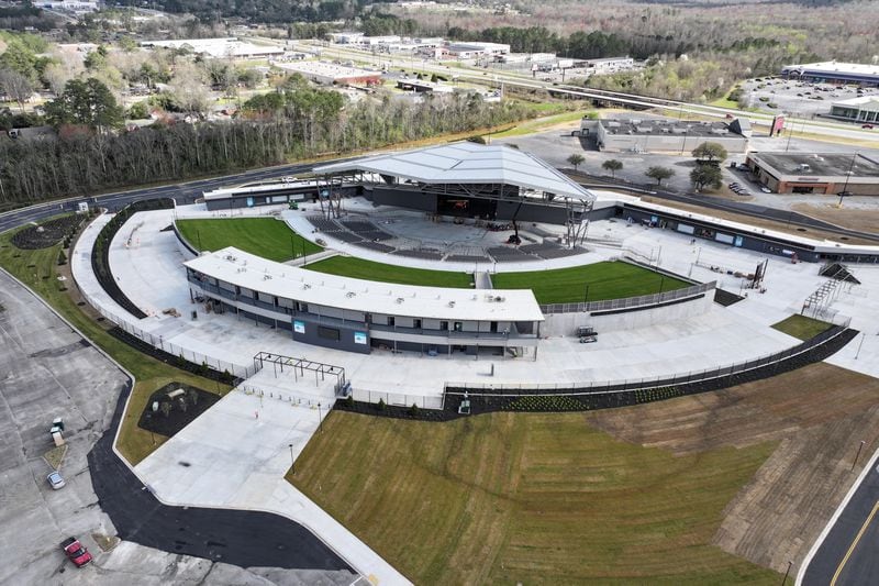 An aerial view of the new Atrium Health Amphitheater in Macon, showing Eisenhower Parkway, also known as U.S. 80, in the far background. (Hyosub Shin / Hyosub.Shin@ajc.com)