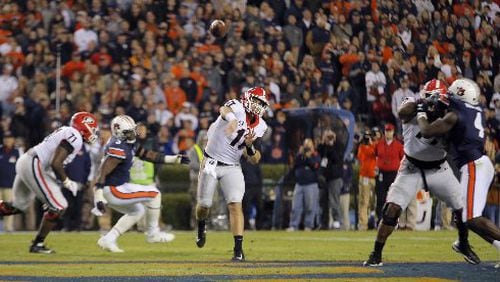 Georgia quarterback Jake Fromm (11) passes against Auburn earlier in the 2017 season. The teams will play in Atlanta on Saturday for the SEC Championship.