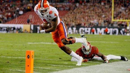 Quarterback Deshaun Watson finishes off an 8-yard touchdown run during the second quarter against the Alabama in Monday’s national championship game. (Kevin C. Cox/Getty Images)