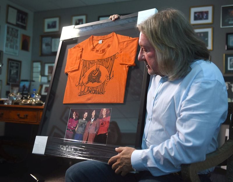 Peter Conlon, president of Live Nation Atlanta, talks about the International Pop Festival. Conlon was a mentee of concert promoter Alex Cooley, a producer of the 1969 concert the weekend of July 4. Peter has a lot of memorabilia from the event, including this framed T-shirt from the concert above a pitcure of Led Zeppelin. Photo: RYON HORNE/RHORNE@AJC.COM