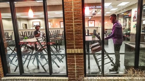 Dining-room chairs being stacked early Monday morning at a Chick-fil-A on 1901 Peachtree Rd NE in Atlanta.