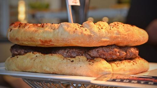 The Burgerizza, from Slice, will be one of the offerings for the 2017 Braves season at SunTrust Park. However, the Atlanta Braves will let fans bring in outside food, as long as it will fit in a clear, gallon-size container. CHRIS HUNT / SPECIAL