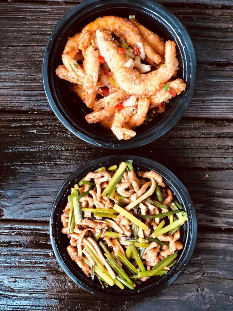 These takeout orders of salt and pepper shrimp and pork with chive flowers came from Great Sichuan in Johns Creek. CONTRIBUTED BY WENDELL BROCK