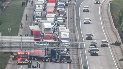 The wreck that shut down I-75 North at Hudson Bridge Road on Thursday morning appears to involve a motorcycle. A body could be seen lying on the interstate.