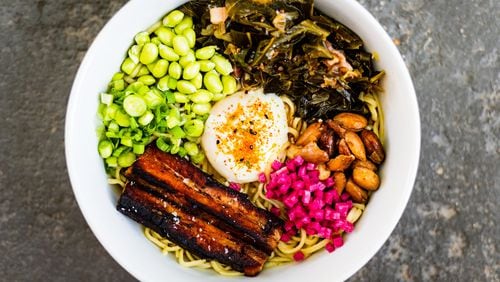 BoccaLupo cooks down collard greens, pork belly and barrel-aged soy for its ramen. CONTRIBUTED BY HENRI HOLLIS