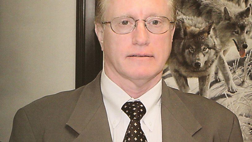 This is a copy of a displayed photograph showing Dr. Joseph L. Burton, who was indicted along with seven other individuals by a federal grand jury on charges of illegal distribution of opioid painkillers and other drugs announced by U.S. Attorney Byung J. “BJay” Pak and law enforcement officials at the Richard Russell Federal Courthouse on Thursday, March 1, 2018, in Atlanta.