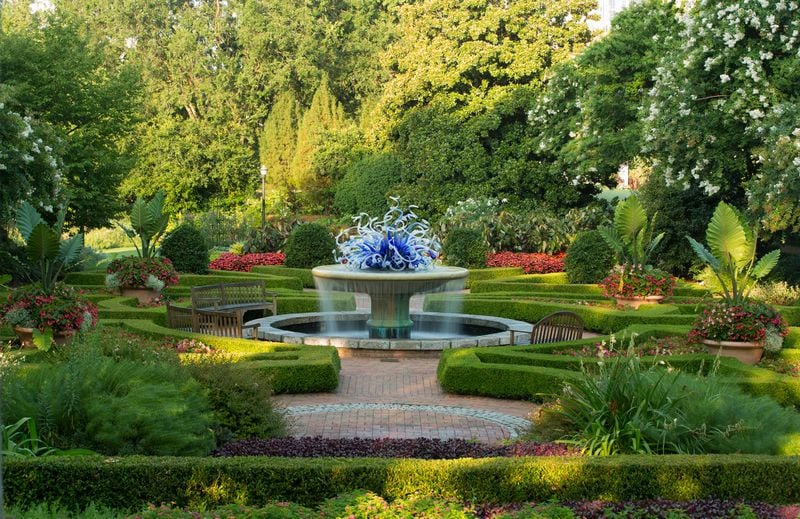 The parterre at the Atlanta Botanical Garden blends a surrounds a Chihuly sculpture with formal elegance. Photo: Jason Getz