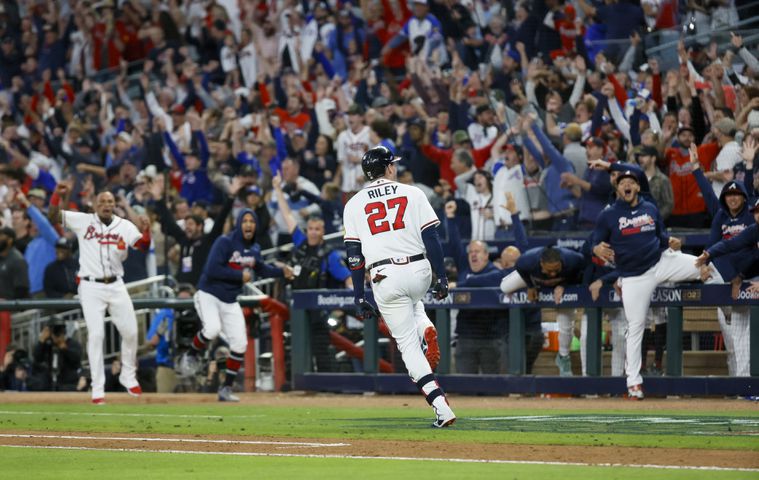 Atlanta Braves’ Austin Riley (27) hits a two-run home run against the Philadelphia Phillies during the eighth inning of NLDS Game 2 in Atlanta on Monday, Oct. 9, 2023.   (Miguel Martinez / Miguel.Martinezjimenez@ajc.com)
