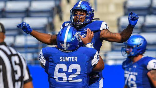 Georgia State running back Destin Coates celebrates a touchdown with center Malik Sumter in the first half of Georgia State's game against Arkansas State on Oct. 5, 2019 at Georgia State Stadium. (Photo: Dale Zanine/Georgia State Athletics)