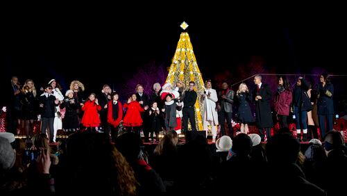 The Obamas join performers and other participants at the 2015 National Christmas Tree Lighting ceremony. The annual event takes place this year on Nov. 30.(AP Photo/Carolyn Kaster)