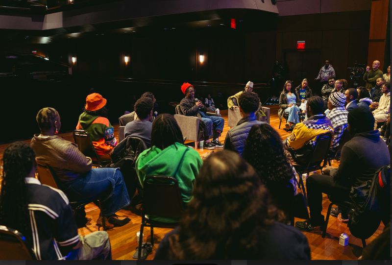 Andre 3000 chats with students about his creative process during a conversation at the Ray Charles Performing Arts Center.