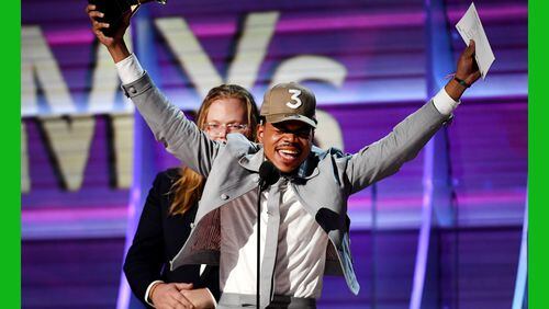 An exuberant Chance The Rapper accepts the award for Best Rap Album at the 59th annual Grammy Awards. (Photo by Kevork Djansezian/Getty Images)