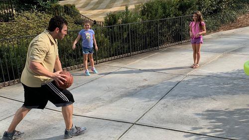 Georgia Tech men's basketball coach Josh Pastner plays in the driveway of his daughters Kamryn (in purple) and Payten (pink). (Photo courtesy Josh Pastner)