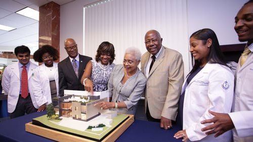 In 2015, baseball legend Hank Aaron and his wife, Billye Suber Aaron, announced a $3 million gift to Morehouse School of Medicine to expand the Hugh Gloster Medical Education building and create the Billye Suber Aaron Student Pavilion. The gift was presented during the school’s 40th anniversary and 31st fall convocation, white coat and pinning ceremony. (Courtesy of Morehouse School of Medicine)