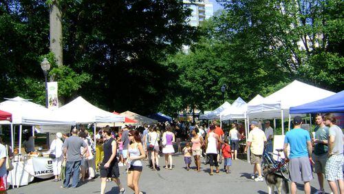 Crowds gather to buy fresh produce and meats at the Green Market. SPECIAL