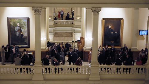Lobbyists gather on the balcony outside of the House chamber on the final day of the 2018 General Assembly. BOB ANDRES /BANDRES@AJC.COM