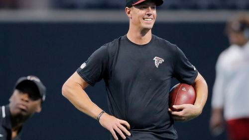 8/26/17 - Atlanta, GA - Atlanta Falcons quarterback Matt Ryan seems to like what he sees as he takes the field for early pregame warmups. The first game in Mercedes-Benz Stadium was Saturday, as the Atlanta Falcons played Arizona in an exhibition game. JOHN SPINK /JSPINK@AJC.COM