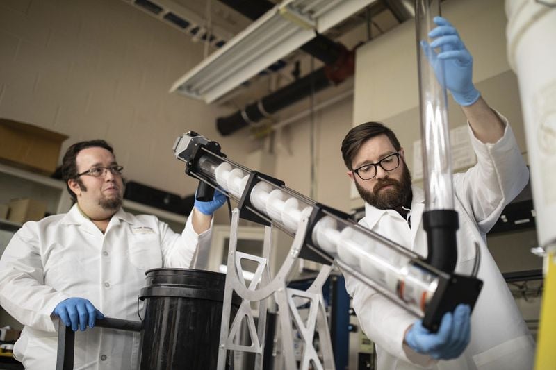 Michael Jeffries, (left) a research technologist, and Liam Renaghan, a senior research engineer, at Georgia Tech Research Institute work in the lab on an auger, which may be a component in a self-contained toilet that a team from the university is trying to perfect. The Bill & Melinda Gates Foundation gave Georgia Tech a $13.5 million grant to lead a world-wide team’s effort to create a toilet that can function wtihout a connection to a sewer line. Courtesy of Georgia Tech