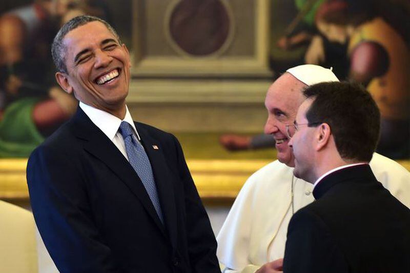 The president, like the Pope, now has an official Twitter account. AP file photo